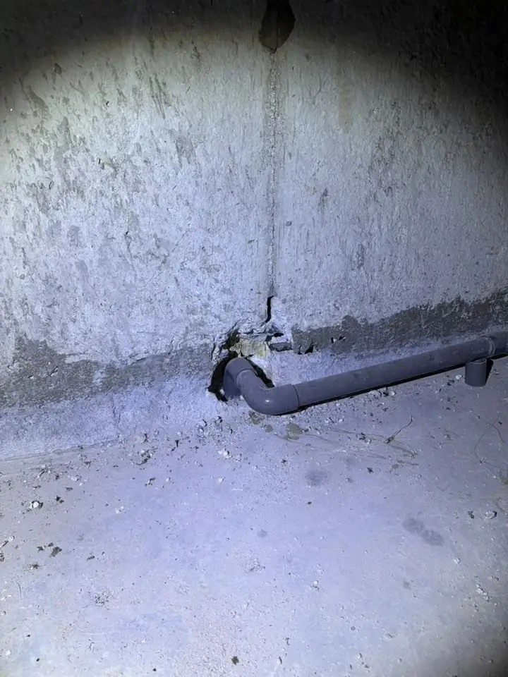 Poor waterproofing at the wall and floor joint around a pipe in a water tank area